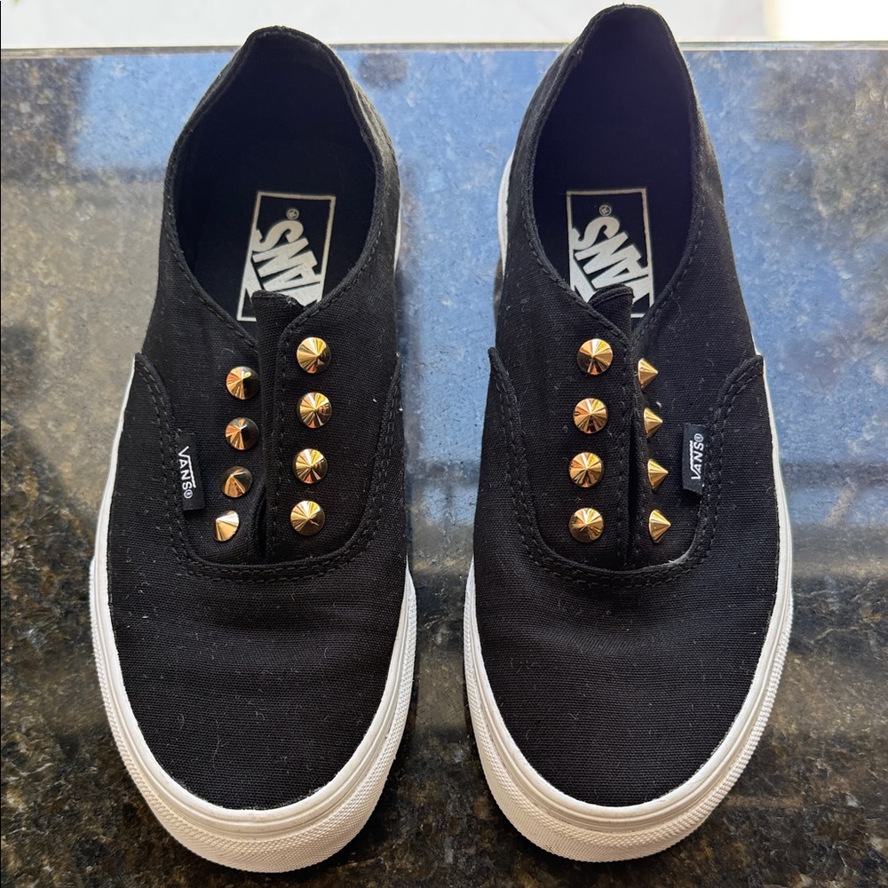 Vans Black Slip-Ons with Gold Accents